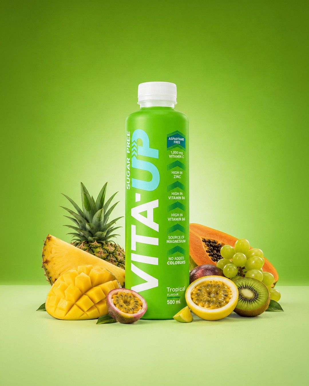 A Tropical bottle of Vita-Up with pineapple, mango, papaya and passion fruit on a green backdrop